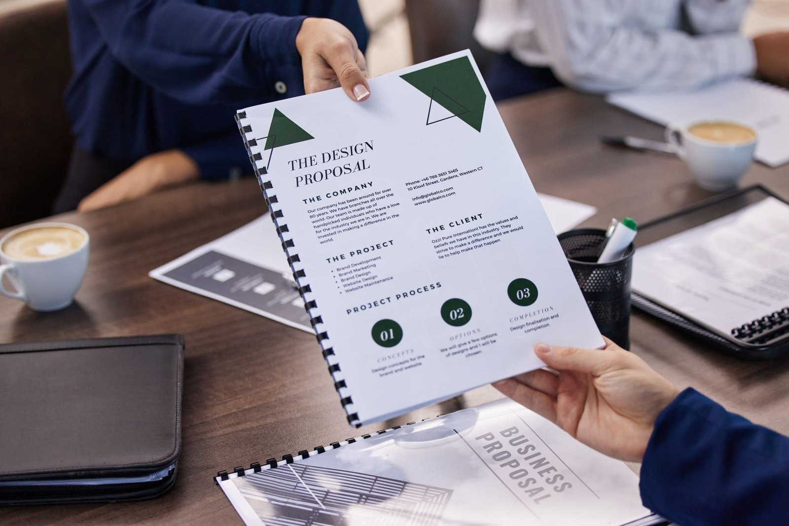 hands-documents-and-design-proposal-by-business-p-2025-04-06-09-45-53-utc (1) (1)